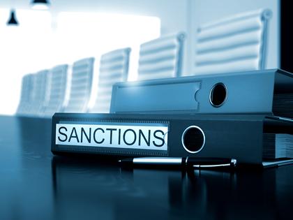 Ordnerstapel beschriftet mit "Sanctions"